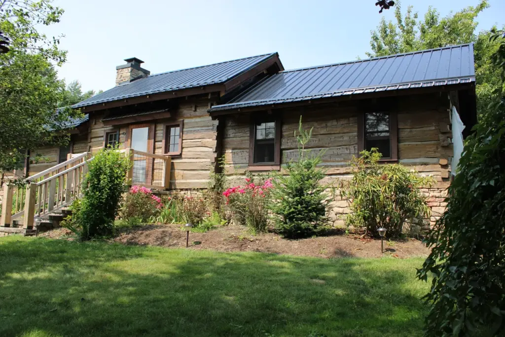 A log cabin home that has been repaired and restored